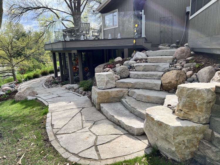 Eden flagstone walkway with Eden stone border and built in fieldstone boulder outcrop accents