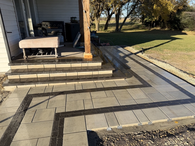 County materials block with charcoal bullnose treads to tie into paver patio design.