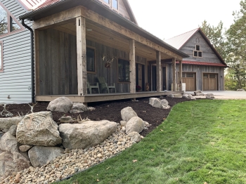 Fieldstone retaining wall for house foundation.