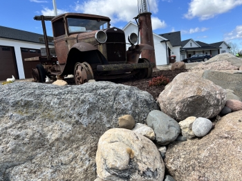Fieldstone boulder with mixed river rock outcropping
