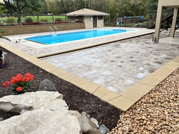 Slab paver patio around pool deck and entertainment area.