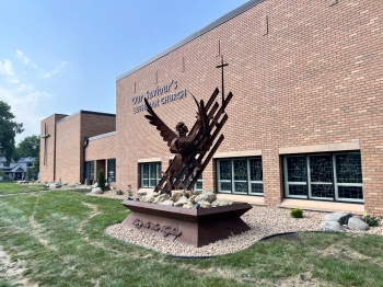 Beautiful landscape renovation for Our Saviors Luthern Church.  Project includes landscaping, planting, lawn restoration, fieldstone boulder outcroppings, and a paver patio with seating boulder and stone benches. 