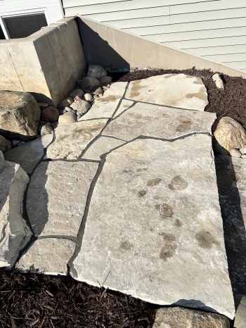 Large Eden irregular stone steps with fieldstone boulder outcroppings and Eden flagstone landing pad.