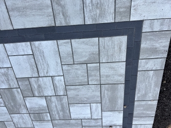 Beautiful Techo Bloc slab paver patio with charcoal inside border. 