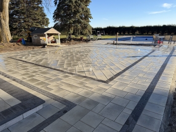 Techo bloc 3-Piece slab paver set with textured charcoal border. 