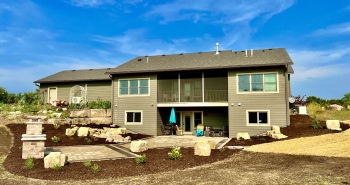 Beautiful county materials - elements paver patio with cobble paver border accent. Patio overlooks a breathtaking horse pasture and native prairie giving our customer the perfect place to enjoy everything they love in life.