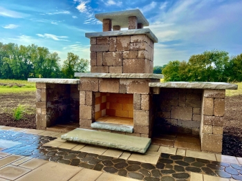 Beautiful county materials - elements paver patio with cobble paver border accent. Patio overlooks a breathtaking horse pasture and native prairie giving our customer the perfect place to enjoy everything they love in life.