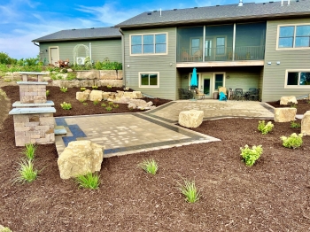 Beautiful county materials - elements paver patio with cobble paver border accent. Patio overlooks a breathtaking horse pasture and native prairie giving our customer the perfect place to enjoy everything they love in life.