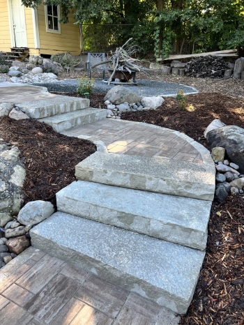 Snapped Eden stone steps mixed with paver walkways with stone borders.